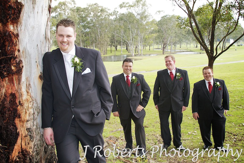 Groom with groomsmen watching - wedding photography sydney